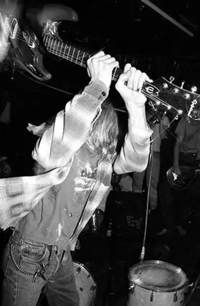 Kurt Cobain smashes his Epiphone ET-270 at the Pyramid Club, New York, April 1990