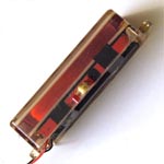 Side view of Gibson Marauder humbucker with red windings visible