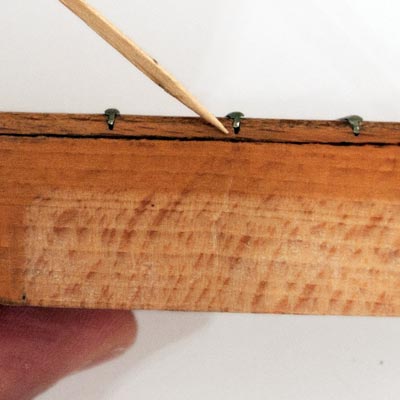 Lifted frets are easily held in place with a tiny drop of superglue, before hammering or pressing into place