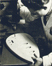 Vox prototype designer Mick Bennett drills holes for control knobs, of a Vox Mark guitar at the Dartford plant, United Kingdom